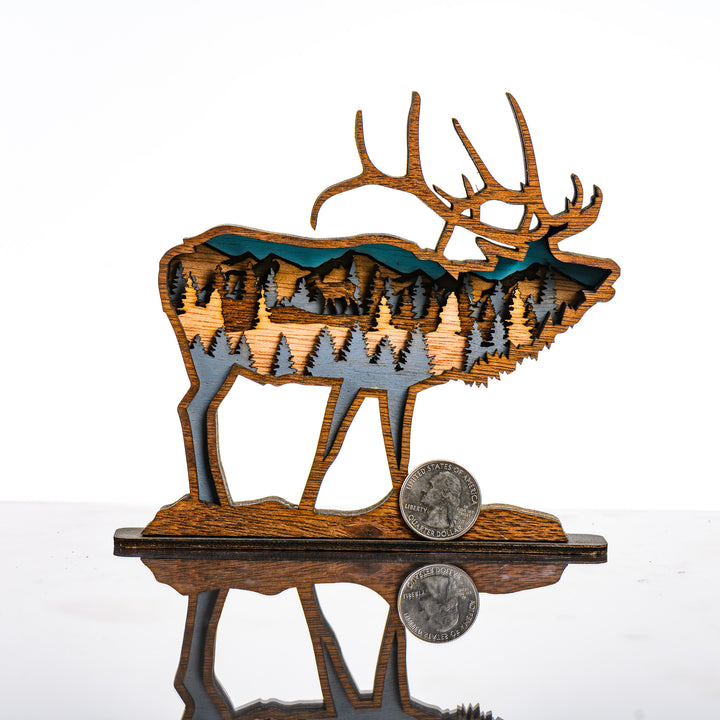 Elk 3D Layered Wood Art made in Montana by RJS Engraving & Design - laser-cut wood art depicting trees and mountains inside the silhouette of an elk, Mini with scale