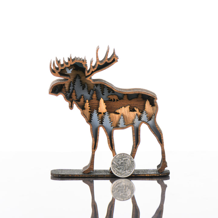 Moose 3D Layered Wood Art made in Montana by RJS Engraving & Design - laser-cut wood art depicting trees and wildlife within the silhouette of a moose, Mini w/ scale