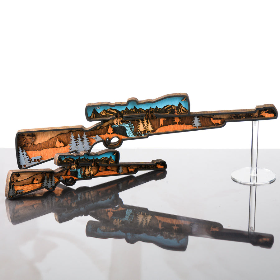 Rifle 3D Layered Wood Art made in Montana by RJS Engraving & Design - laser-cut wood layers depict a wildlife and hunting scene within the silhouette of a rifle, 2 sizes