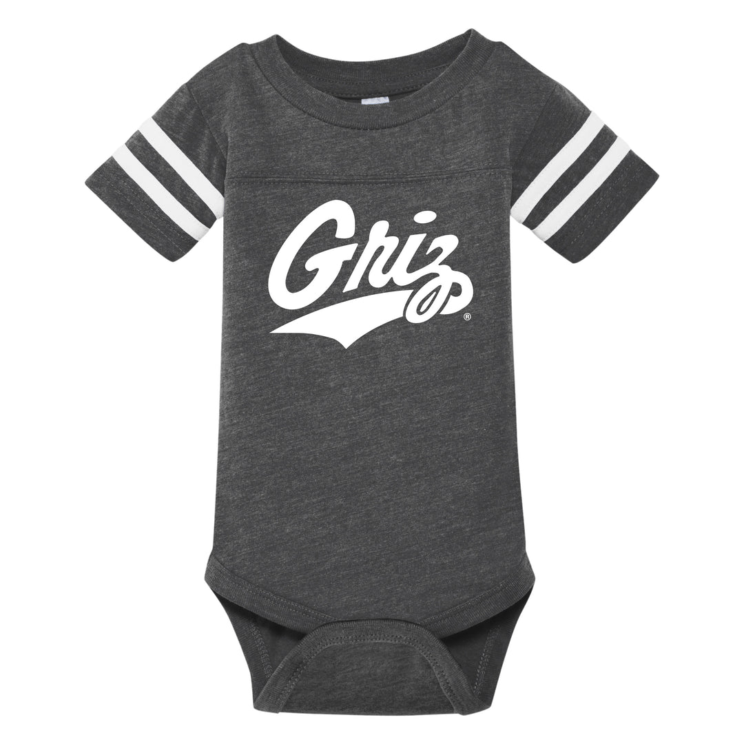 A charcoal, gray infant onesie, with white stripes on the sleeves printed with a white University of Montana Griz script in a soft, fuzzy material