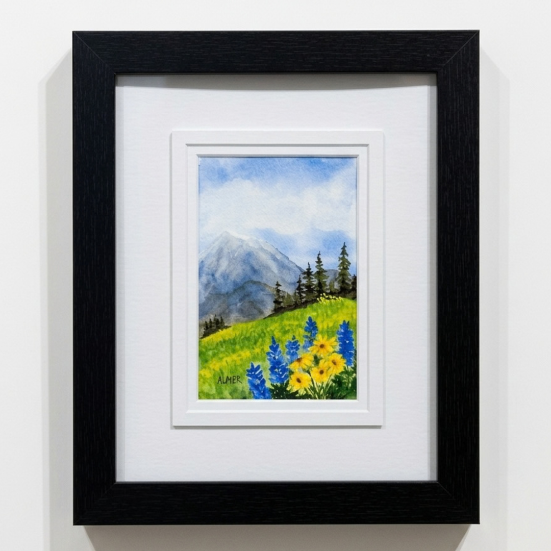 Original watercolor painting of vibrant mountain wildflowers framed in a 9.5x11.5 black frame. Made in Montana by Stark Mountain Studio artist Bobbe Almer.