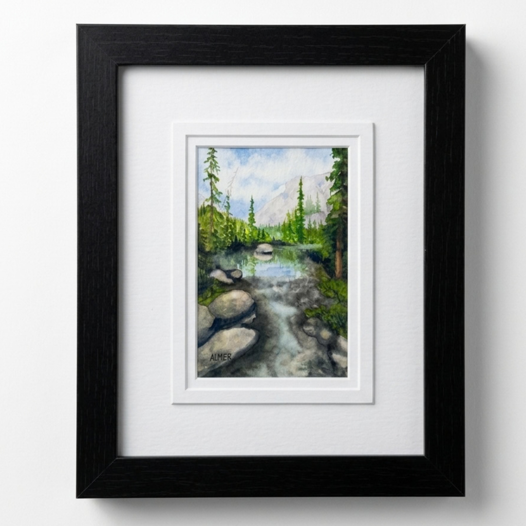 Bring home the Blodgett Creek Original Watercolor Painting by Stark Mountain Studio. Beautifully framed in a 9.5x11.5 black frame. Made in Montana &amp; USA.