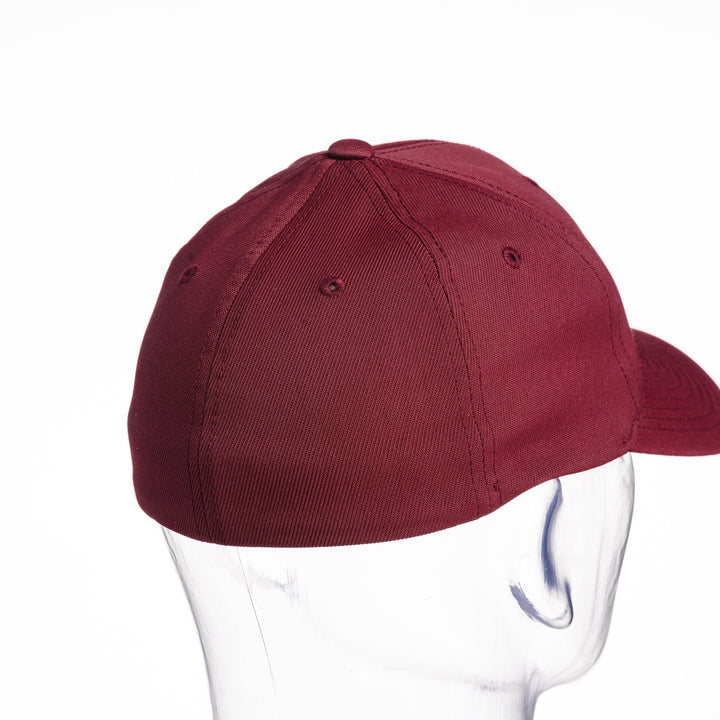 Blue Peaks Creative's maroon Performance Solid Cap embroidered with the Montana Griz Script in black and silver, back