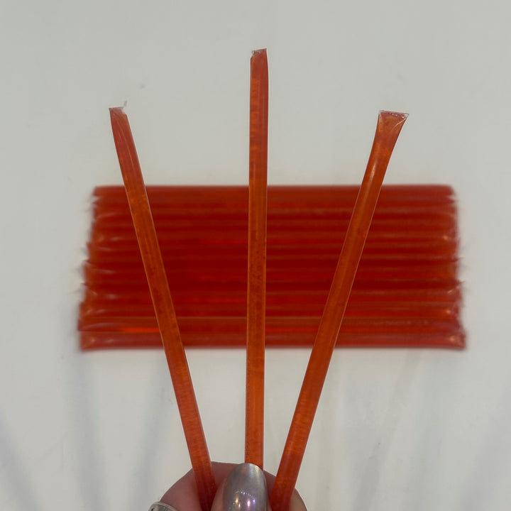Three sour strawberry flavored Honey sticks made in Montana