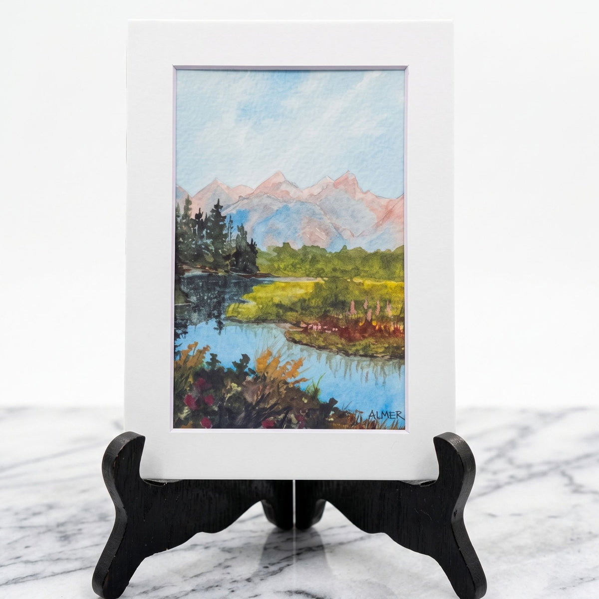 Bring mountain majesty home with the Summer Reflections 5x7 Matted Print by Stark Mountain Studio. Original Bobbe Almer watercolor art. Made in Montana, USA.