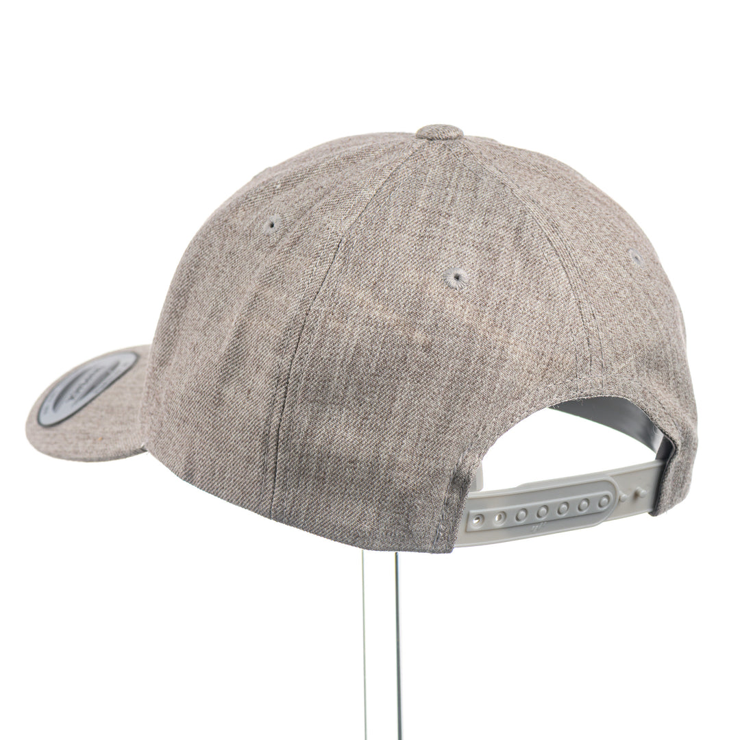 Back of a Tiny Leather Griz Script - Premium Wool Blend Cap—a heather grey premium wool blend snapback hat with a small brown leather Griz Script patch, made in Missoula, Montana (home of the UM Grizzlies) by Blue Peak Creative