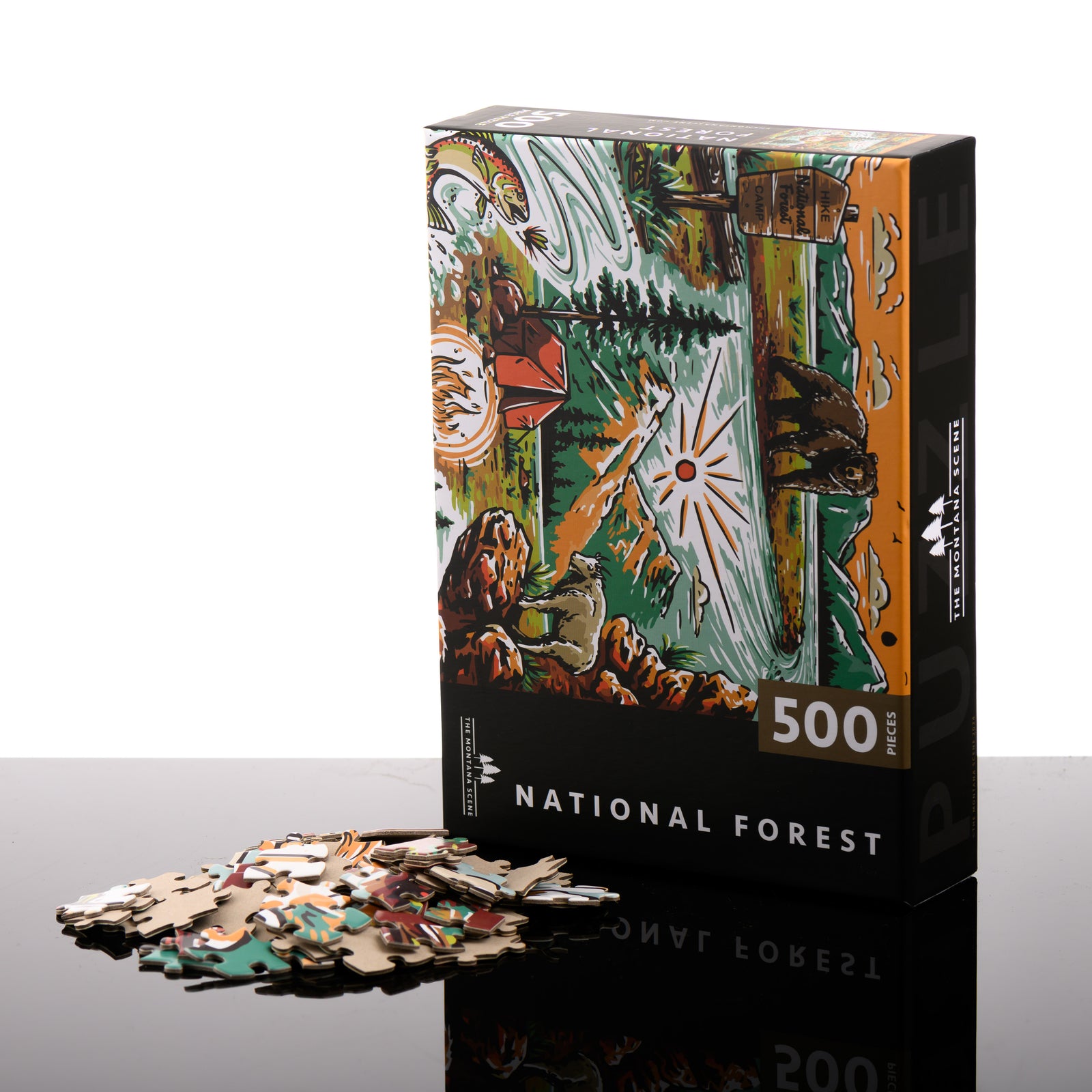 Hand drawn, Montana-made 500 piece puzzle by the Montana Scene--named National Forest-- featuring a bear, national forest sign, fly fishing, tent and mountain goat; image depicts the box front with puzzle pieces.