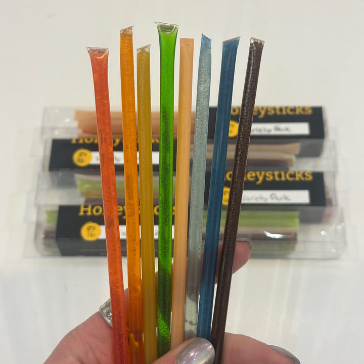 An assortment of rainbow colored honey sticks from Bitterroot Buzz Bees in Montana