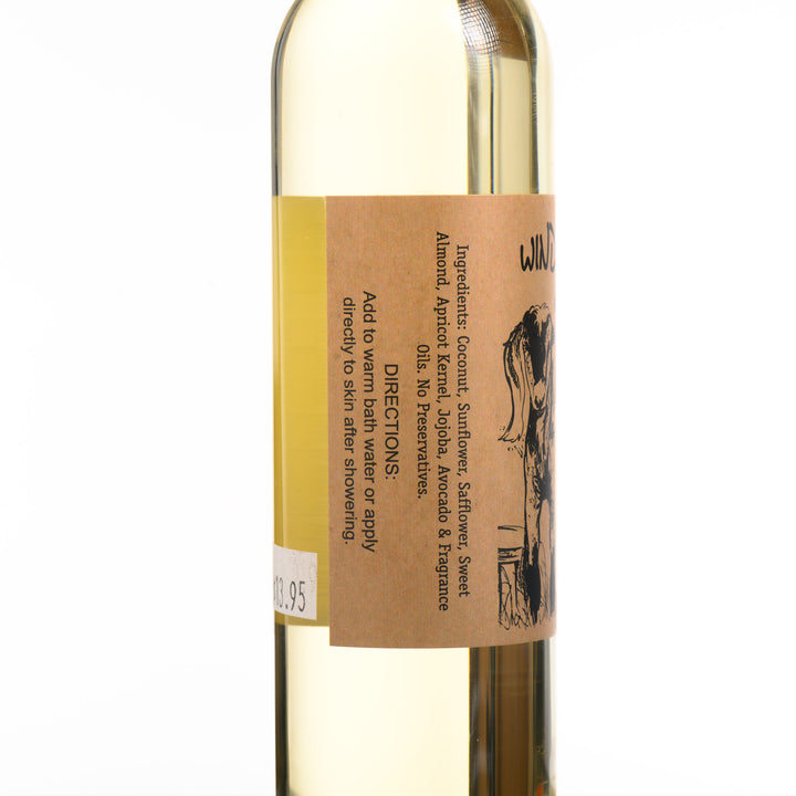 An 8 ounce bottle of Windrift Hill's Montana made, Montana Huckleberry moisturizing body oil. Ingredient list: Coconut, Sunflower, Safflower, Sweet Almond, Apricot Kernel, Jojoba, Avocado &amp; Fragrance Oils