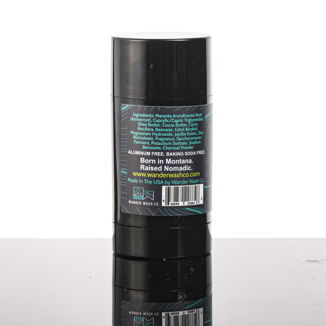 Back (ingredients list) of a 3 oz tube of Natural Deodorant Blue Stick (bergamot, citrus, aromatic herbs) made in Montana by Wander Wash Co, against a white background