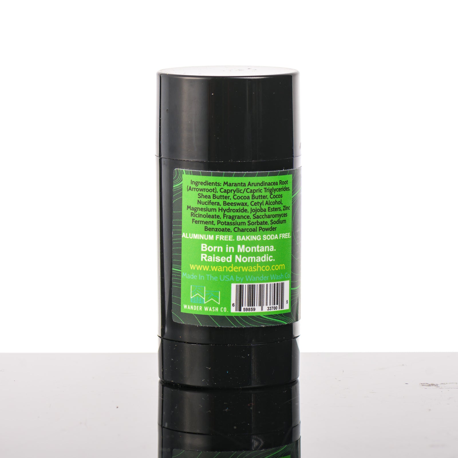 Back (ingredients list) of a 3 oz tube of Natural Deodorant Green Stick (pine, cedar wood, clove, peppercorn) made in Montana by Wander Wash Co, against a white background