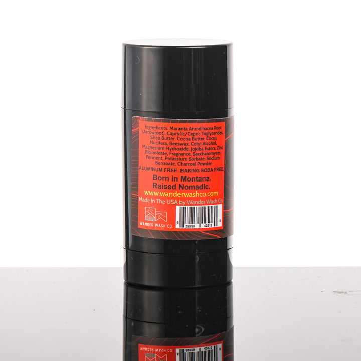 Back (ingredients list) of a 3 oz tube of Natural Deodorant Red Stick (mint, amber, sandalwood, musk) made in Montana by Wander Wash Co, against a white background