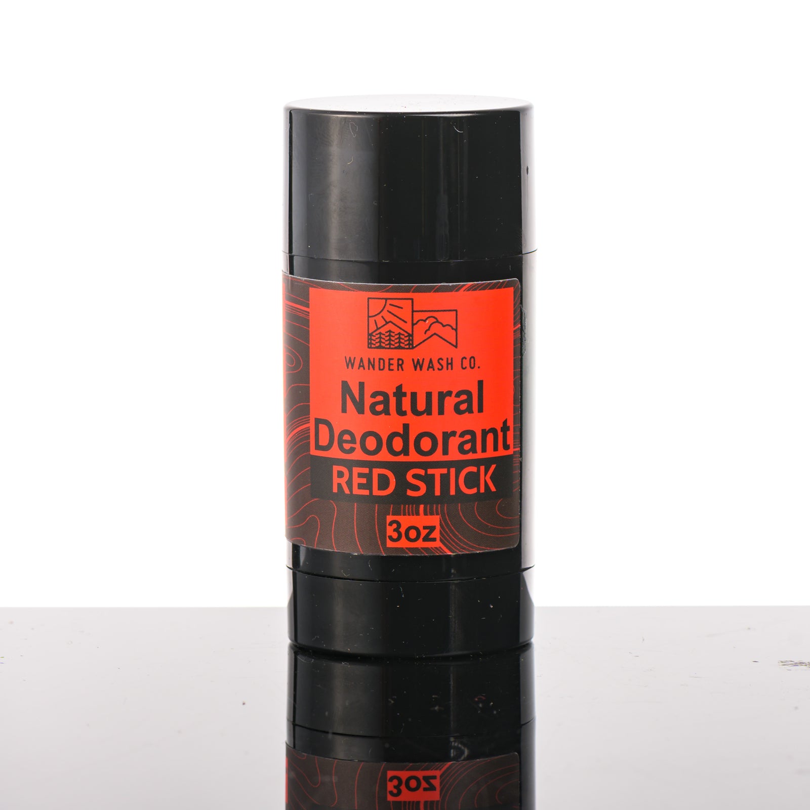 Front of a 3 oz tube of Natural Deodorant Red Stick (mint, amber, sandalwood, musk) made in Montana by Wander Wash Co, against a white background