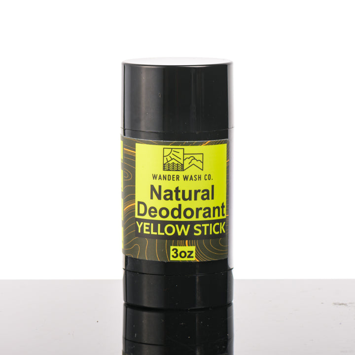 Front of a 3 oz tube of Natural Deodorant Yellow Stick (citrus, wood, moon cactus, and musk) made in Montana by Wander Wash Co, against a white background