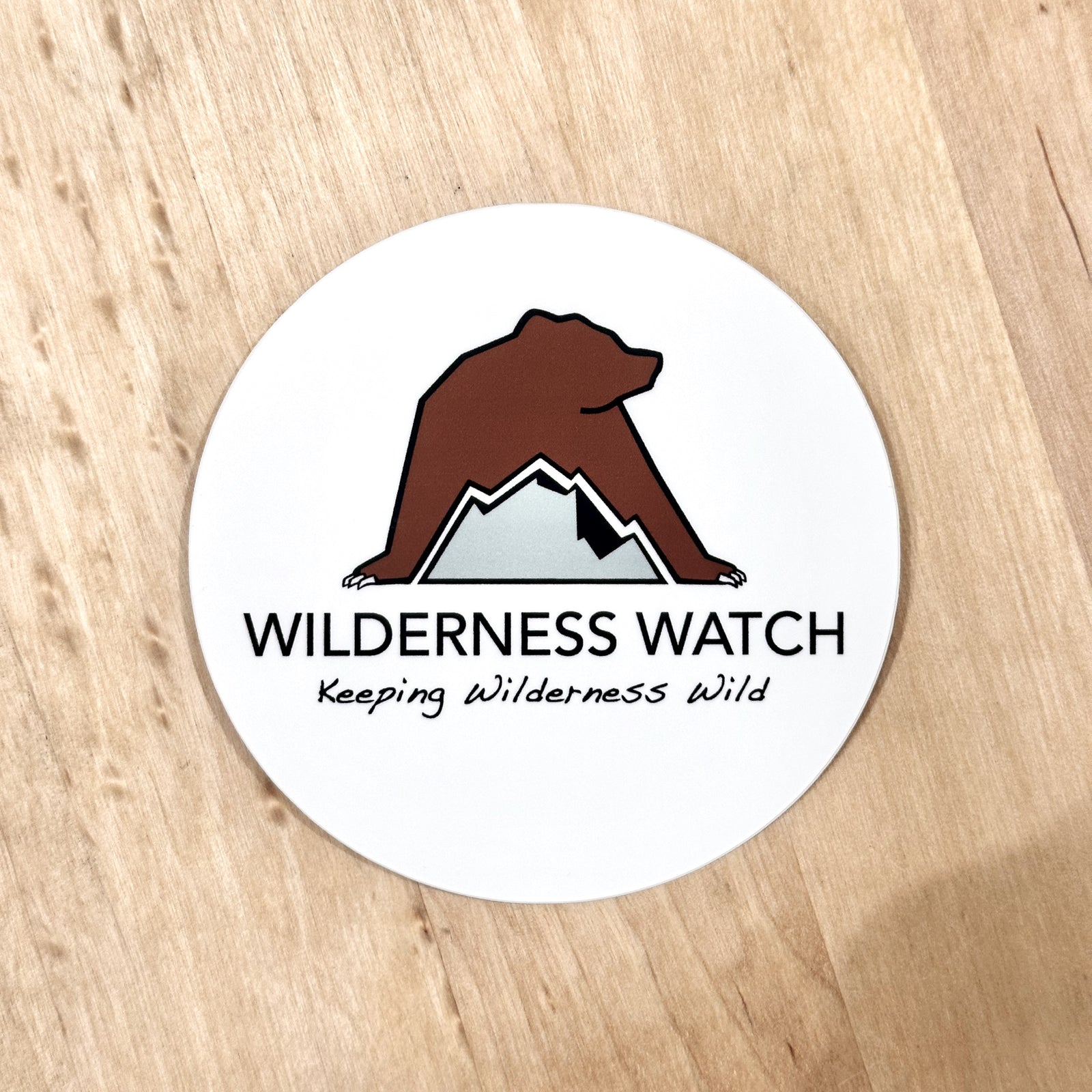 Single Wilderness Watch 3" Vinyl Sticker- full-color water-resistant sticker featuring the Wilderness Watch logo; a portion of sales are donated to the Wilderness Watch fundraiser