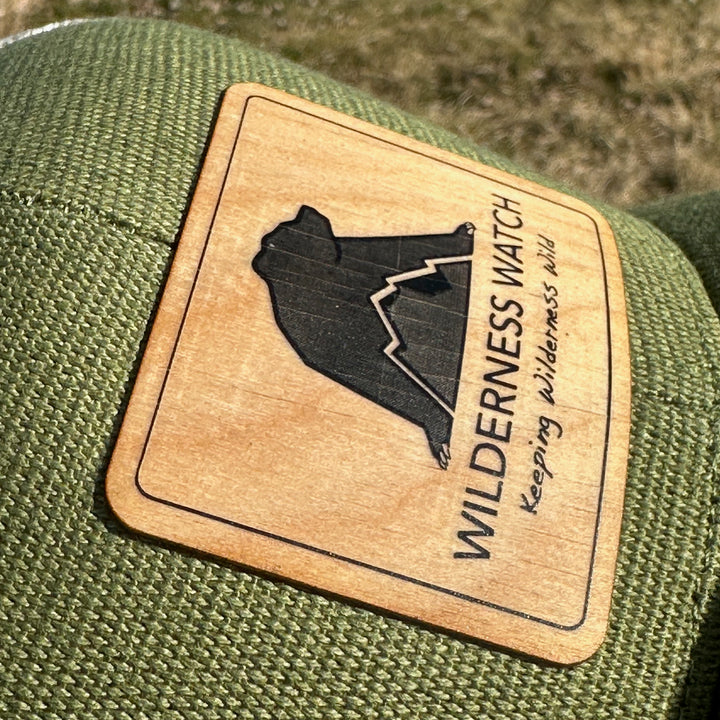 Wooden patch with bear silhouette and &
