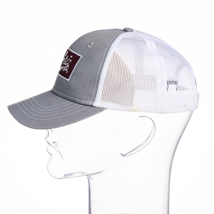 Blue Peaks Creative's grey and white Youth Snapback Trucker Cap embroidered with the Montana Griz Script in maroon and white, side
