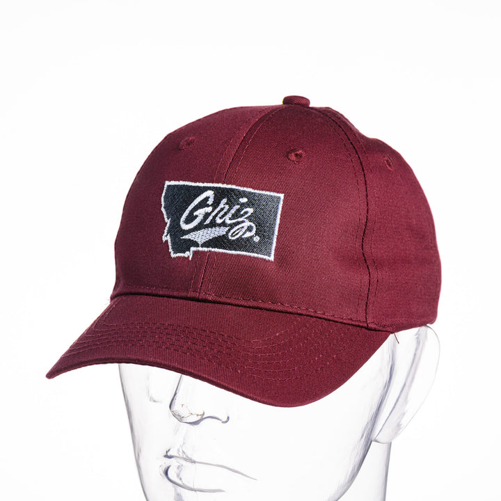 Blue Peak Creative's maroon Youth Six-Panel Twill Cap embroidered with the Montana Griz Script in black and silver, front