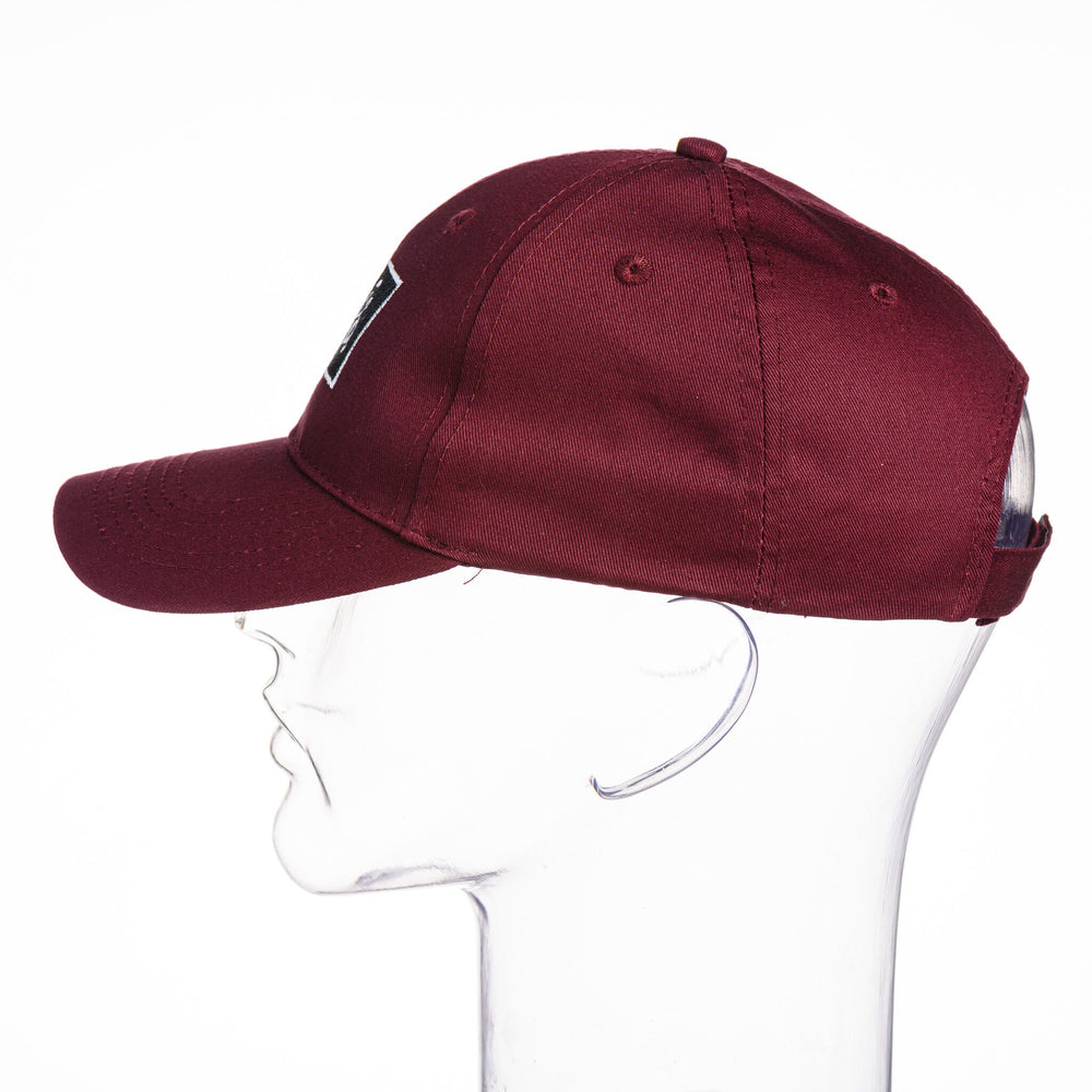 Blue Peak Creative's maroon Youth Six-Panel Twill Cap embroidered with the Montana Griz Script in black and silver, side