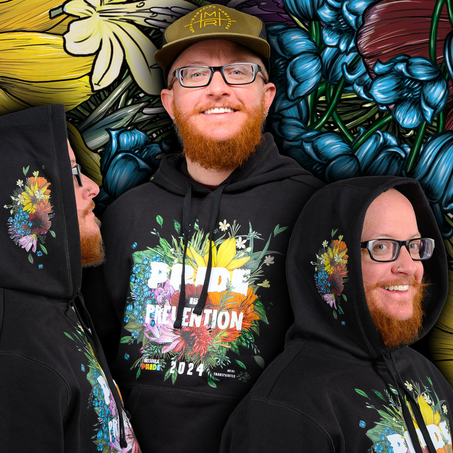 Black hooded sweatshirt featuring the 2024 Missoula PRIDE design Pride is Prevention, front, side, and 3/4 views with design in background
