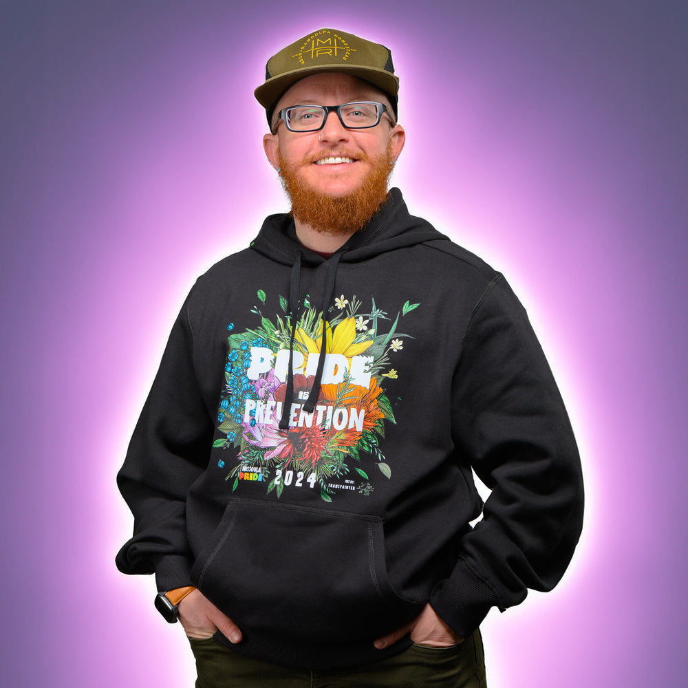 Black hooded sweatshirt featuring the 2024 Missoula PRIDE design Pride is Prevention, front