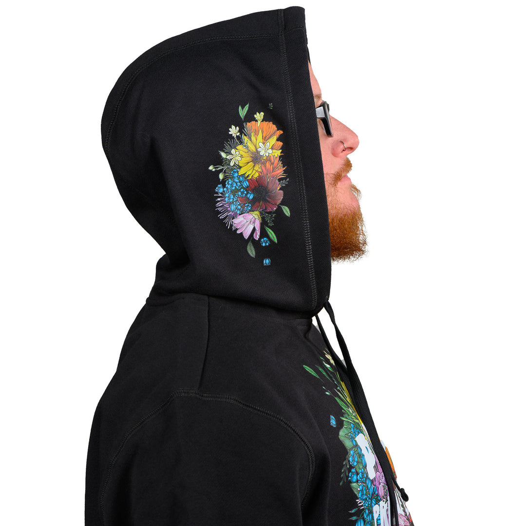 Black hooded sweatshirt featuring the 2024 Missoula PRIDE design Pride is Prevention, hood detail from side view