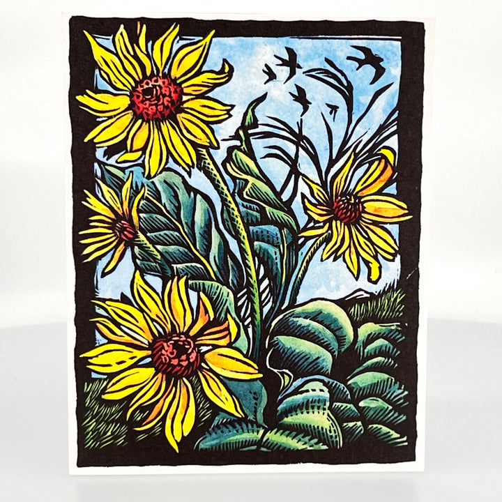 A picture of a greeting card with a wood carving print of the flower Arrow Leaf Balsam Root