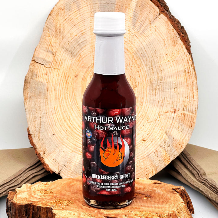 5 oz. Bottle of Huckleberry Ghost Hot Sauce, with Huckleberry, Ghost Pepper, and Pineapple, made in Montana by Arthur Wayne Hot Sauce