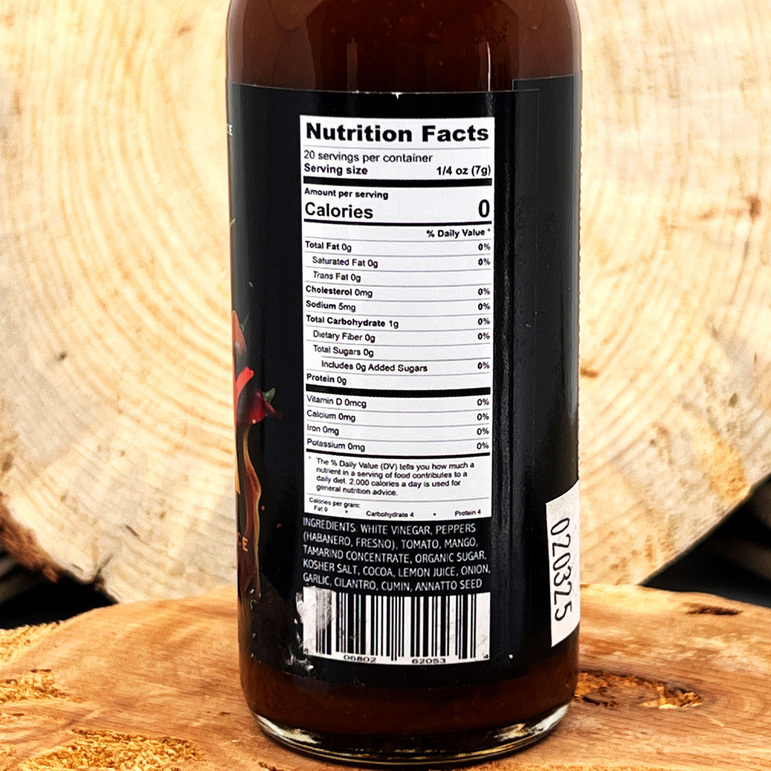 5 oz. bottle of Spicy Mama Hot Sauce, with Peppers (Habanero, Fresno), Tomato, Mango, Tamarind Concentrate, Cocoa, Lemon Juice, and spices made in Montana by Arthur Wayne Hot Sauce 