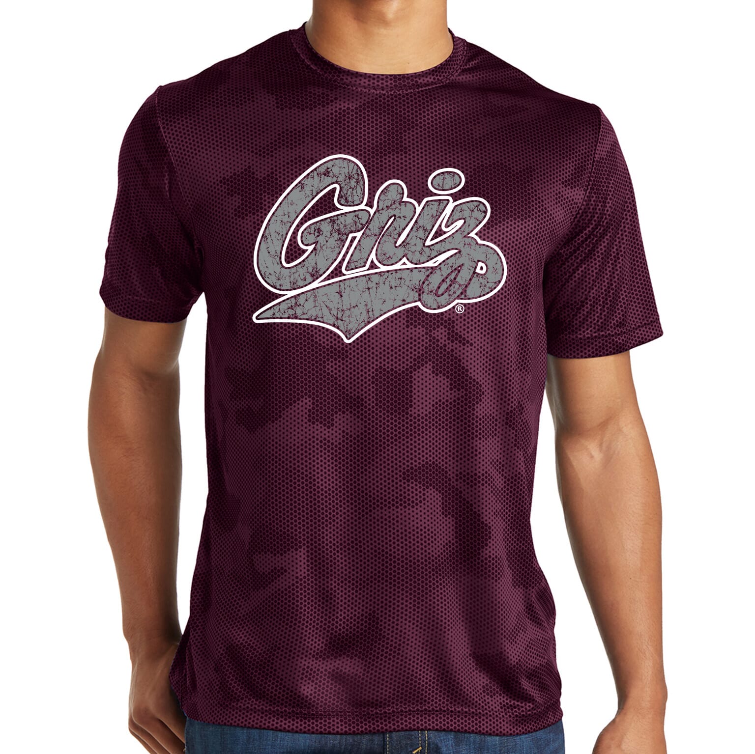 Maroon Distressed Griz Script - Camohex T-shirt made in Missoula, MT (home of the UM Grizzlies) by Blue Peak Creative—a camouflage maroon performance tee printed with the distressed University of Montana Griz script design in silver, outlined in white