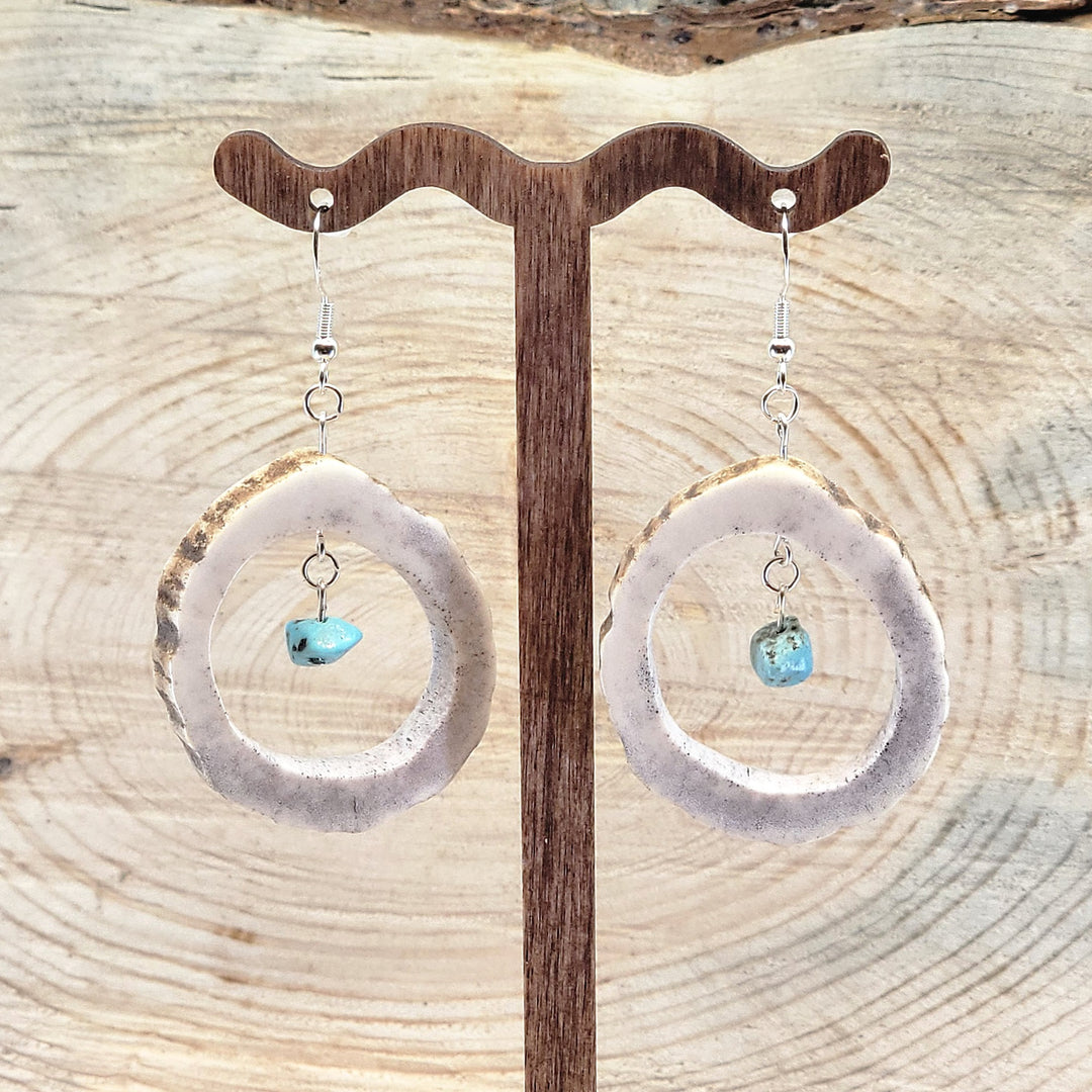 Pair of antler hoop earrings with natural turquoise bead suspended in the middle, from 406 Antlery