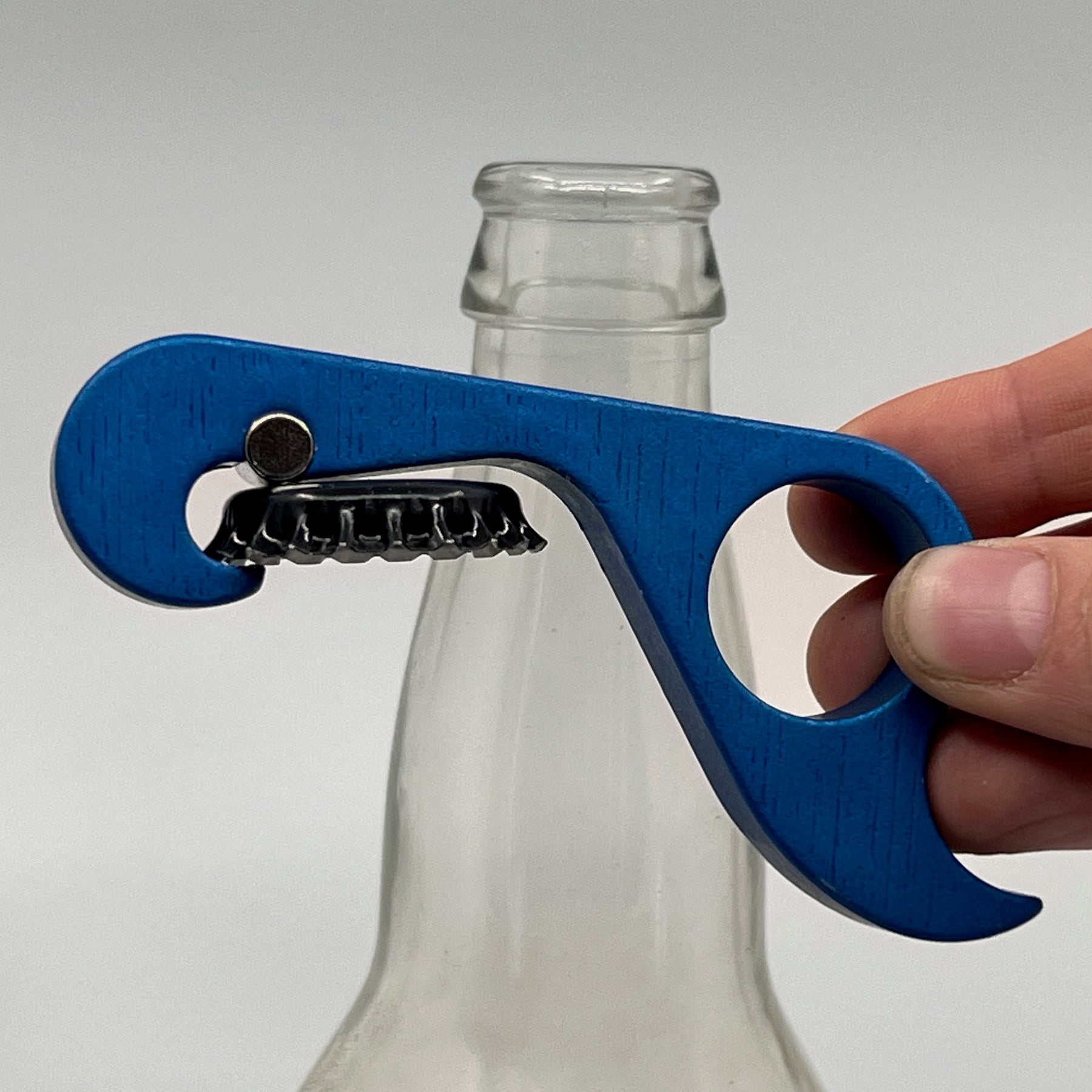GrOpener: Grab and Open Bottles in a Single Motion
