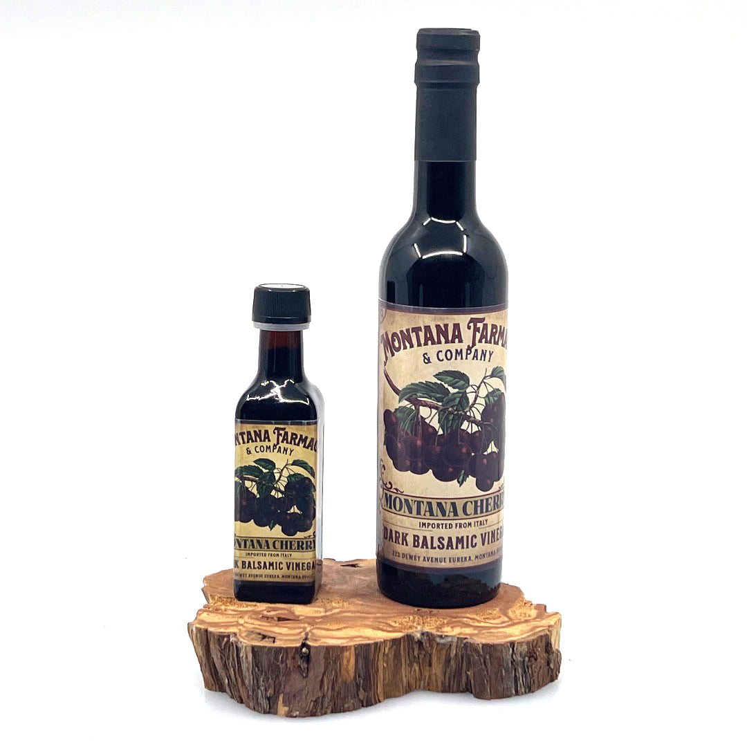 100 ml and 375 ml bottle of Dark Montana Cherry Aged Balsamic Vinegar, made in Montana by Montana Pharmacy
